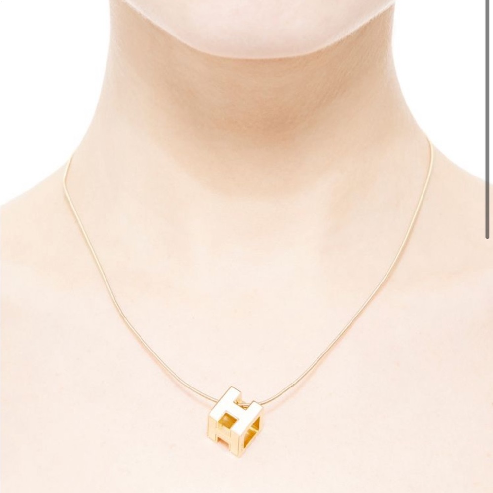 Hermes cage d’H cream and gold pendant necklace